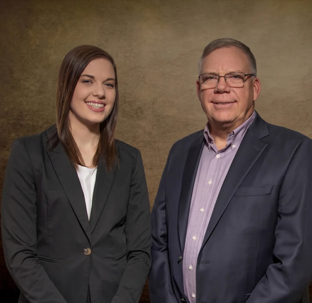 Kelly Business Advisors team members in professional attire posing for a company portrait.